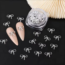 Moños de Metal Plateados con 30pz